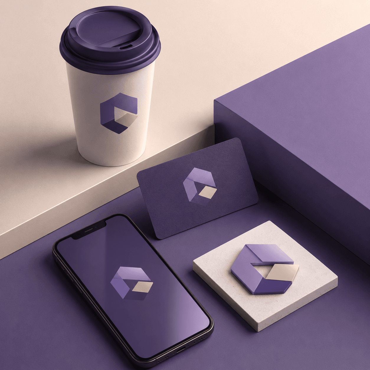 Branding mockup with an AI-generated logo on a business card, a coffee cup and a phone screen